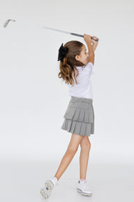 Falda deportiva de golf para niña gris con tablones, bolsa lateral y lycra