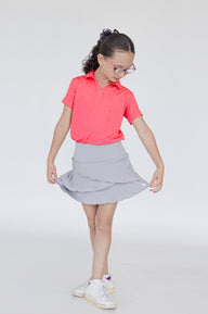 Falda de golf para niña con corte tulipán, lycra dryfit y bolsa trasera, color gris