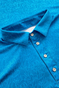Polo de golf azul con estampado abstracto para hombre
