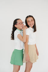 Conjunto old money de golf para niña falda verde y beige 