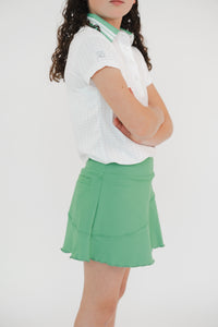 Falda golf verde diagonal niña - Vista lateral bolsa trasera funcional lycra dry Zendra