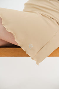 Falda diagonal golf caqui mujer - Corte moderno favorecedor lycra dry secado rápido