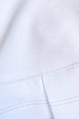 Falda blanca deportiva con lycra dryfit y bolsas para golf