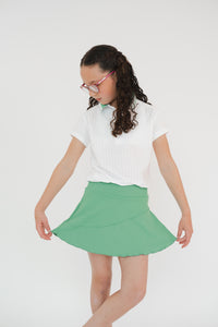 Falda golf diagonal verde niña lycra dry - Tecnología anti-olor secado rápido Zendra