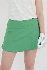 Falda verde de golf para dama corte diagonal con lycra