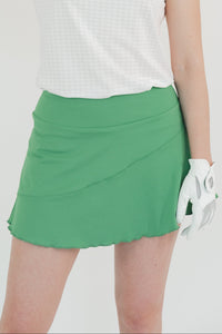 Falda verde de golf para dama corte diagonal con lycra