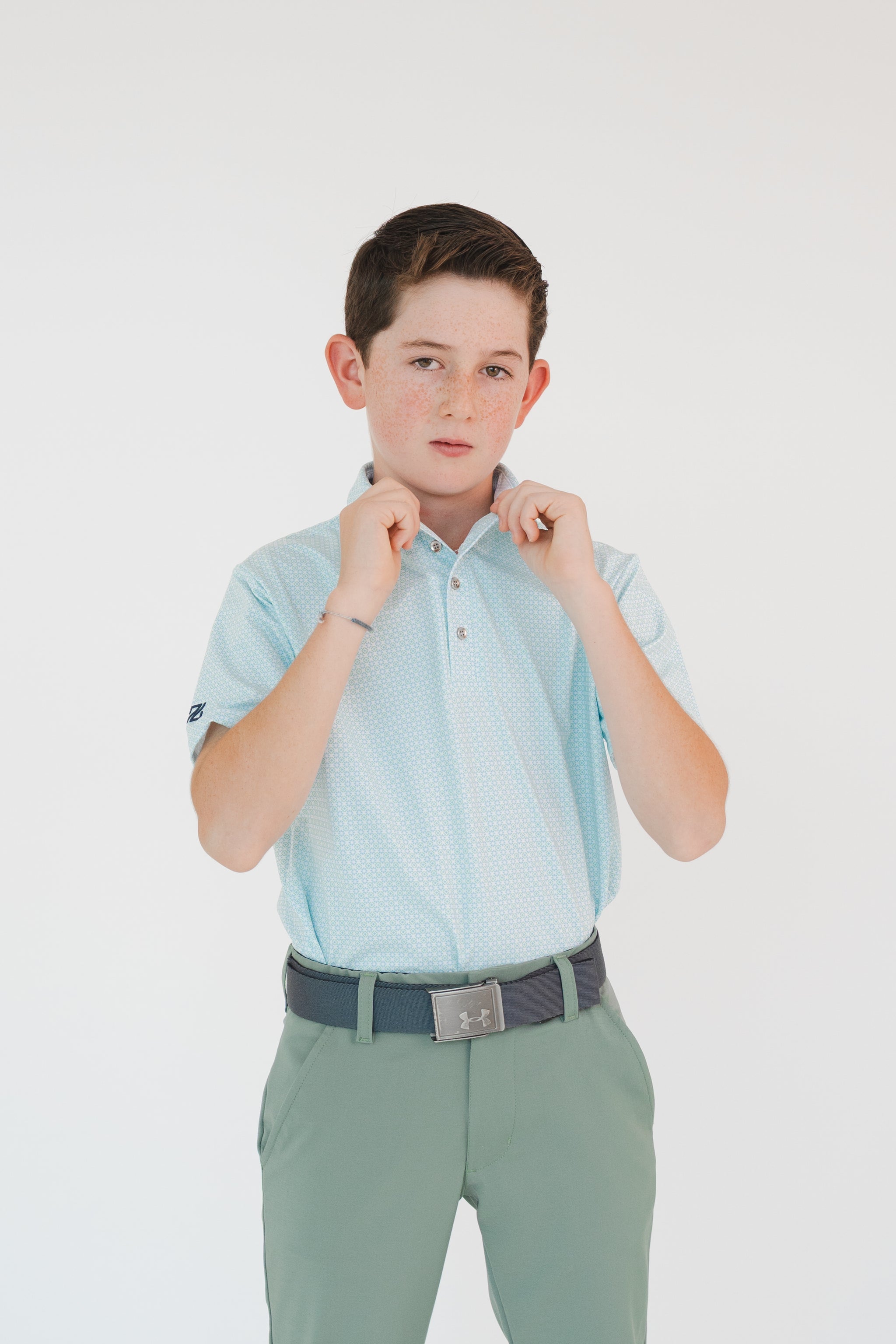 Polo estampada DryFit para niño color azul con diseño deportivo para golf