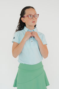 Polo estampada niña DryFit con protección solar UV para golf color azul