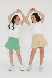 Ropa de golf premium para niña - falda verde y beige con protección UV Zendra Sports
