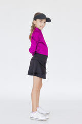 Detalle bolsillo trasero falda negra niña Zendra para golf