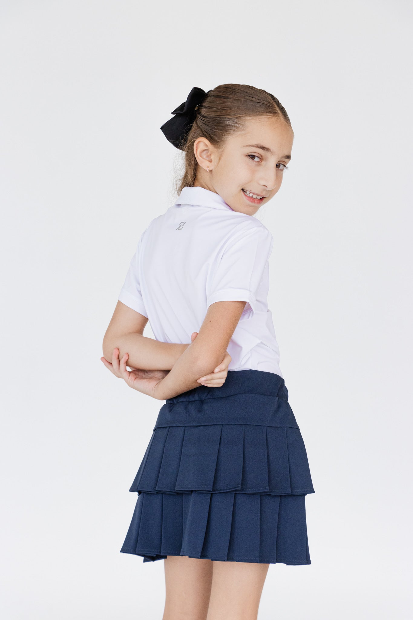 Falda plisada azul para niña con short interior dryfit y bolsa – Zendra