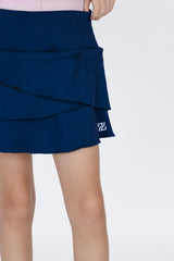 Falda de golf niña Zendra azul marino tulipán con lycra Dry y bolsa trasera