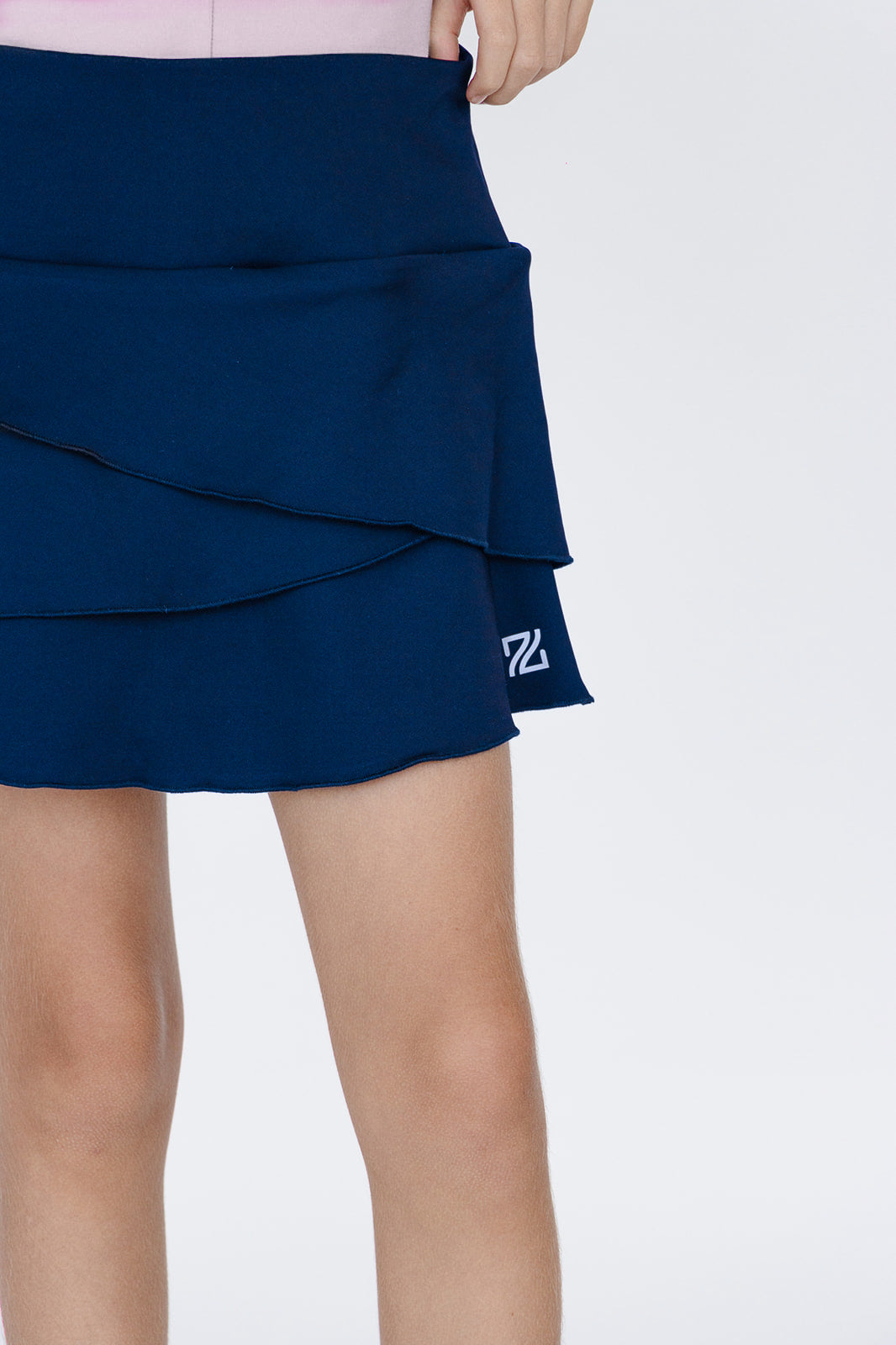 Falda de golf niña Zendra azul marino tulipán con lycra Dry y bolsa trasera