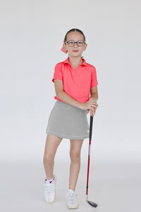 Falda de golf para niña en gris con short interior lycra dryfit