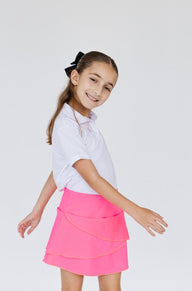 Falda de golf para niña con corte tulipán, lycra dryfit y bolsa trasera, color rosa