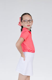 Falda para niña Zendra color blanco ideal para golf, con tela deportiva dryfit y bolsa