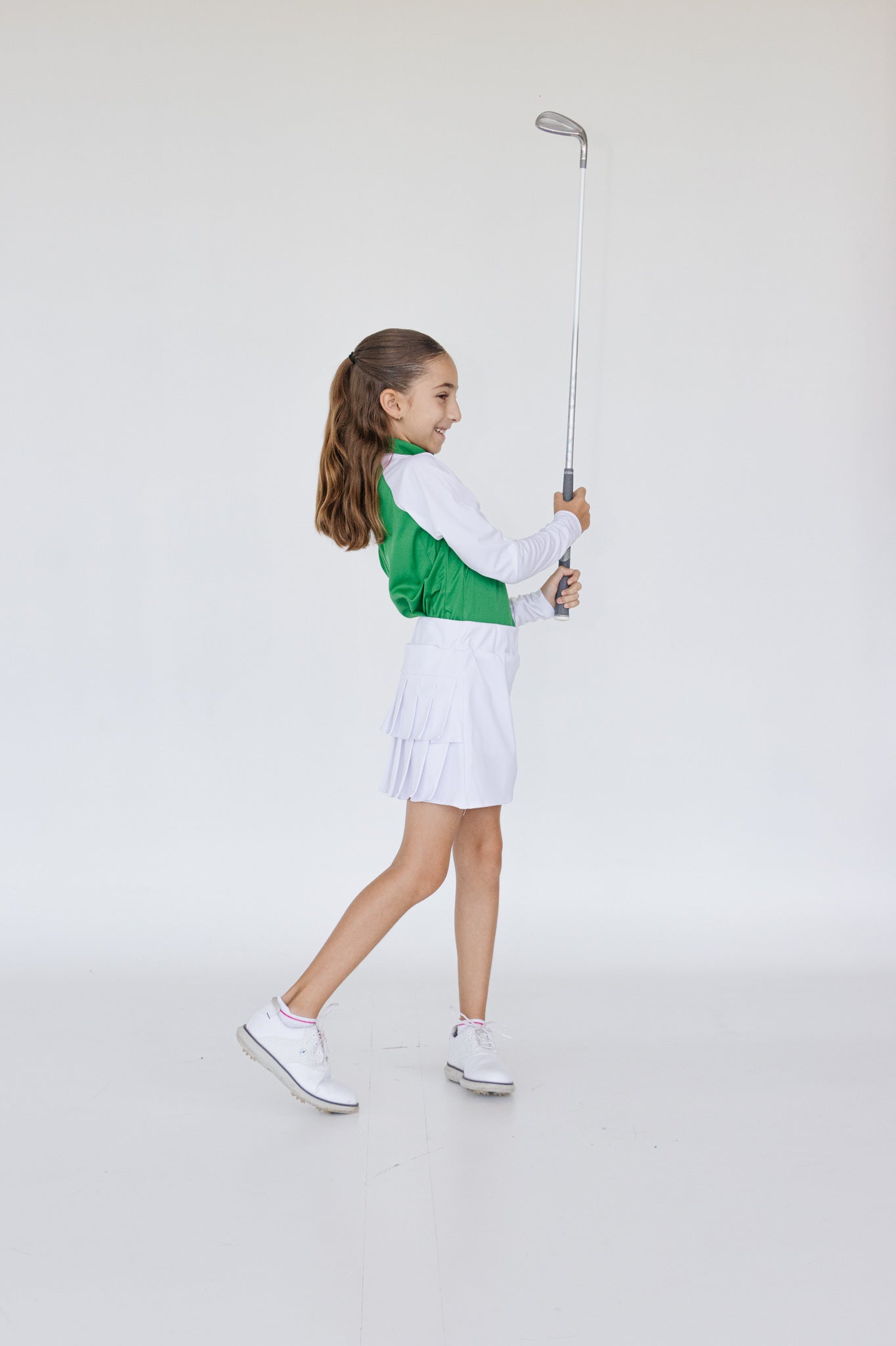 Falda plisada blanca para niña con lycra interior dryfit y bolsa