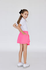 Falda de golf o peal para niña con corte tulipán, lycra dryfit y bolsa trasera, color rosa fosforescente