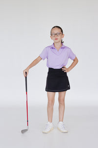 Niña usando polo lila Zendra para golf –  Dry y protección UV