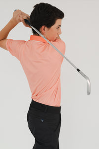 Vista trasera polo golf DryFit coral niño - Playera deportiva Zendra Sports